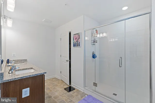 a utility room with a sink and a mirror
