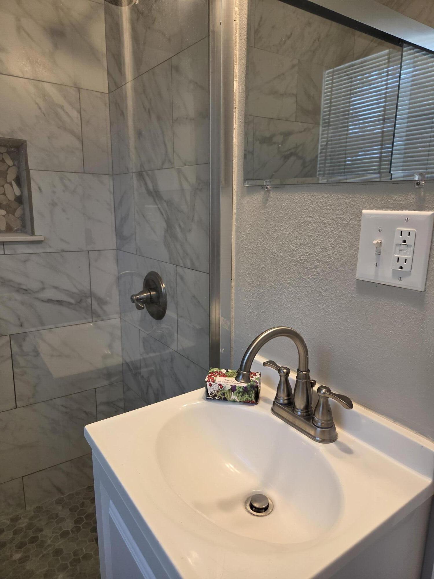 23 Ranger Street Southwest Fort Walton Beach, FL 32548 - Photo 7 of 17 a bathroom with a sink and a mirror