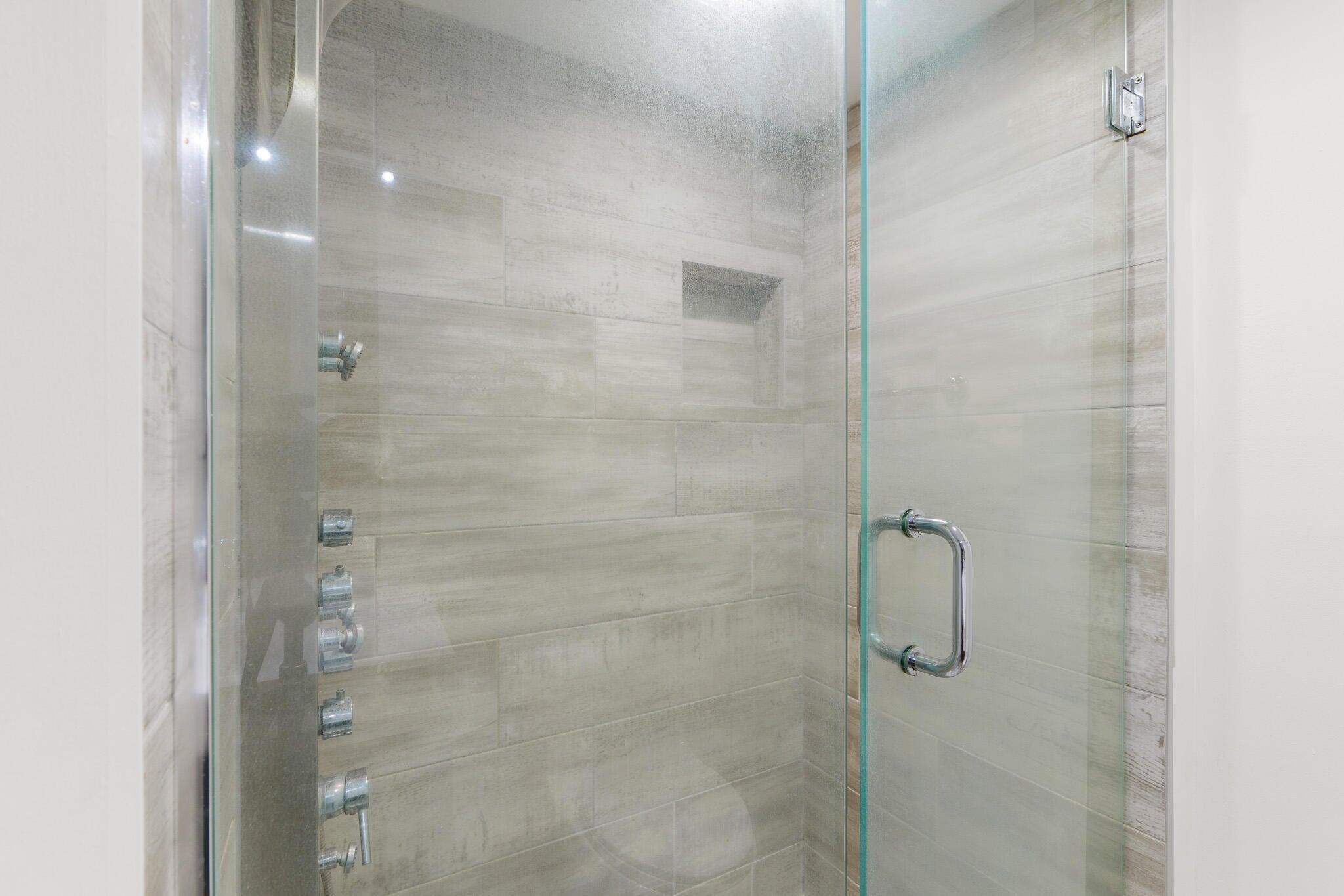951 De Soto Road, Unit 130 Boca Raton, FL 33432 - Photo 16 of 38 a bathroom with a shower