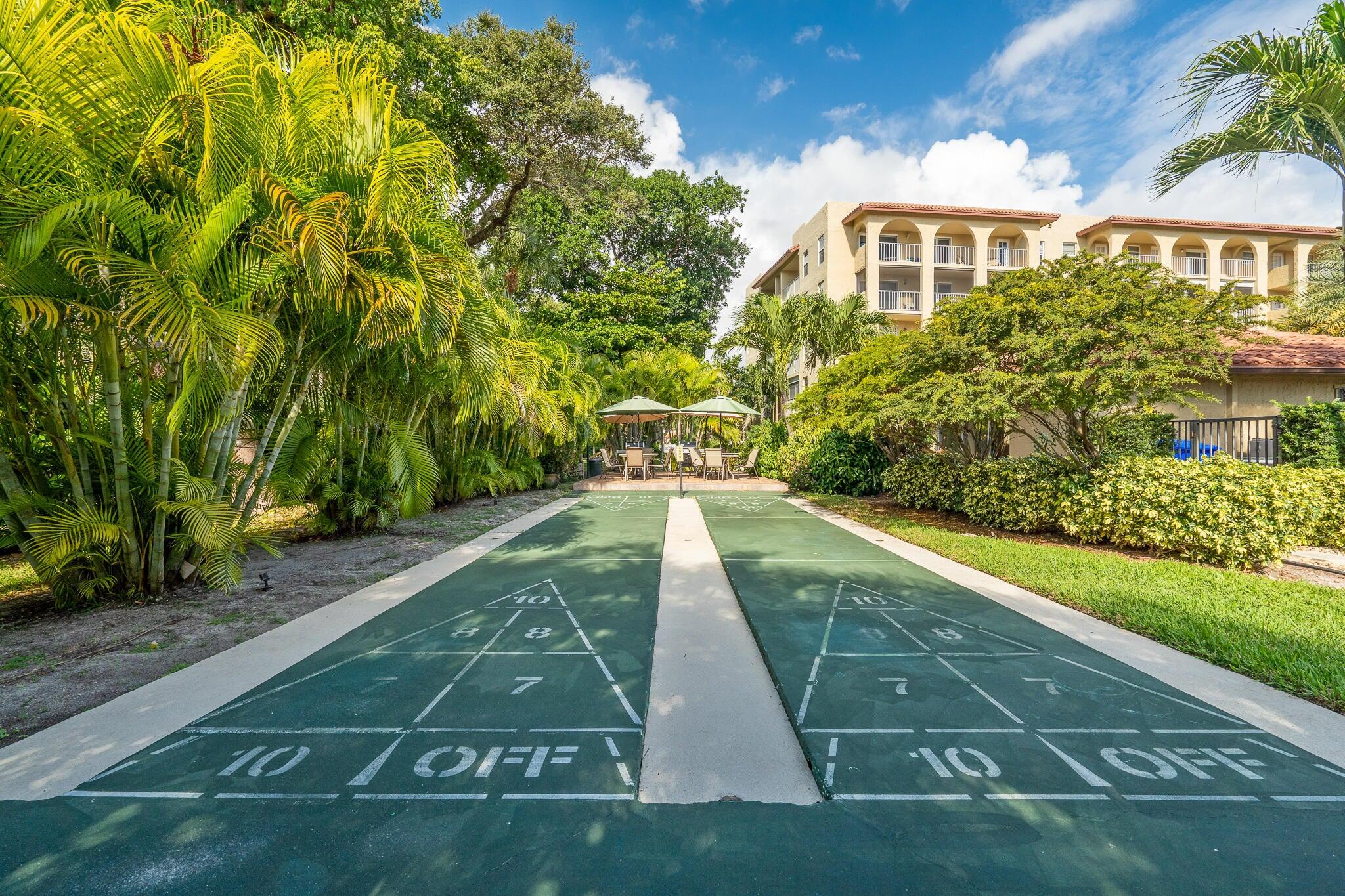 951 De Soto Road, Unit 130 Boca Raton, FL 33432 - Photo 31 of 38 a view of a yard of the house