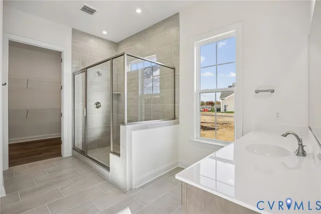 a bathroom with a tub and shower
