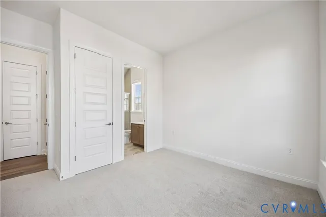an empty room with closet area
