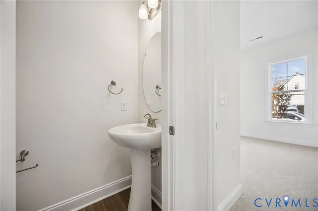 a bathroom with a sink and mirror