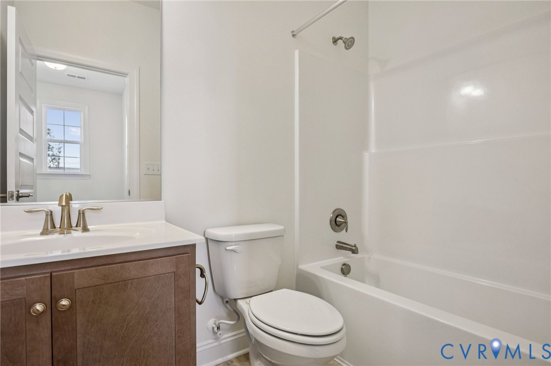 1042 Arbor Heights Terrace Midlothian, VA 23114 - Photo 18 of 35 a bathroom with a sink a toilet and shower