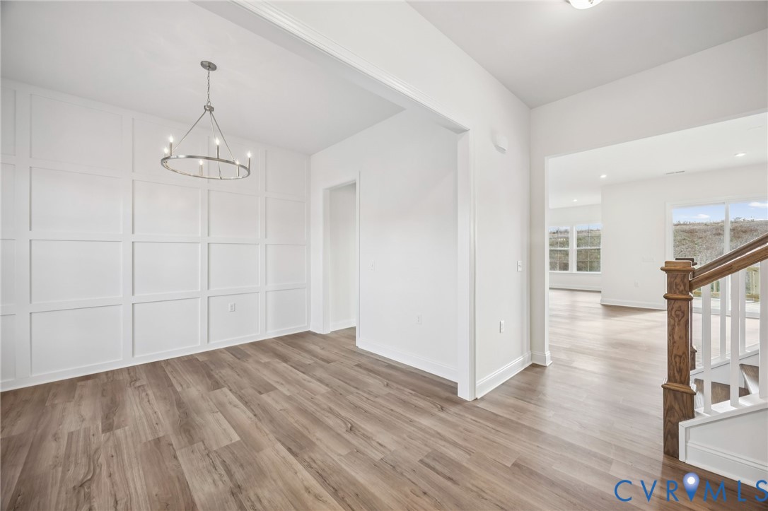 1042 Arbor Heights Terrace Midlothian, VA 23114 - Photo 2 of 35 wooden floor in an empty room with a window
