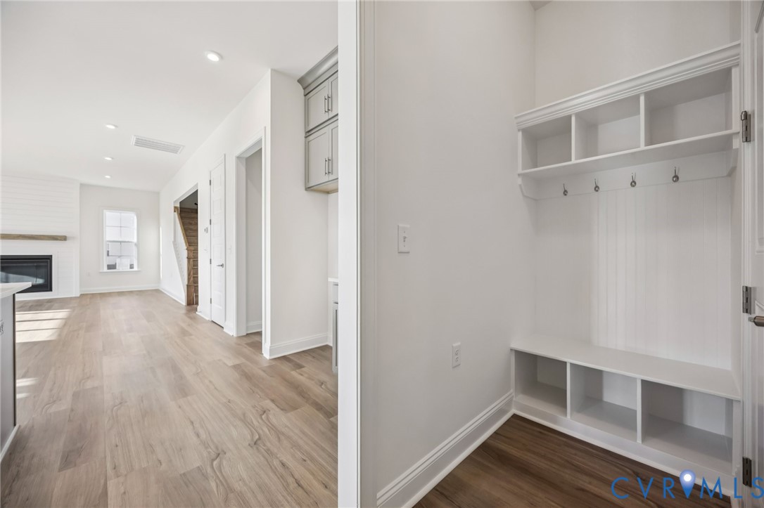 1042 Arbor Heights Terrace Midlothian, VA 23114 - Photo 4 of 35 a view of an empty room with wooden floor and a window