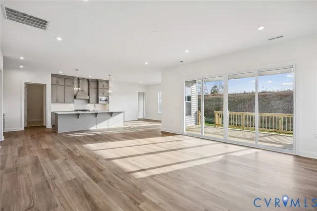 a view of kitchen with wooden floor and windows