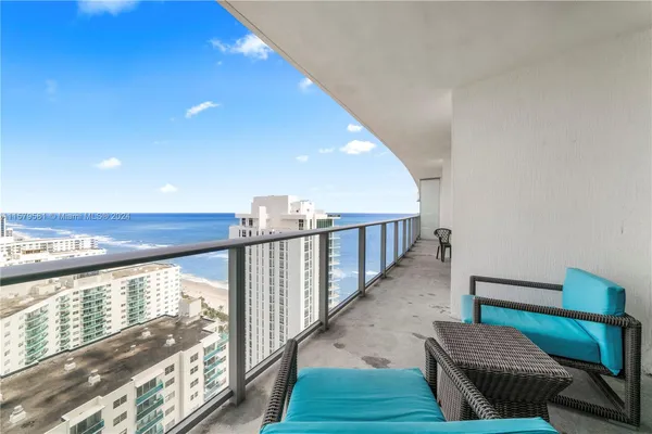 a view of balcony with furniture