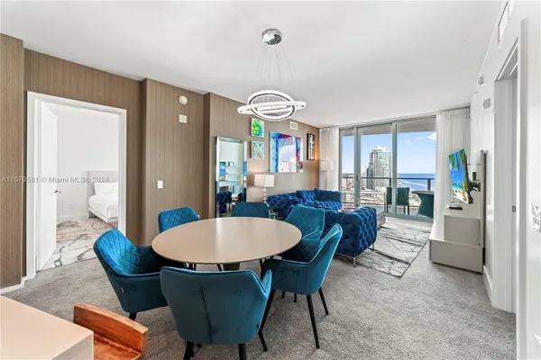 a view of a dining room with furniture window and wooden floor