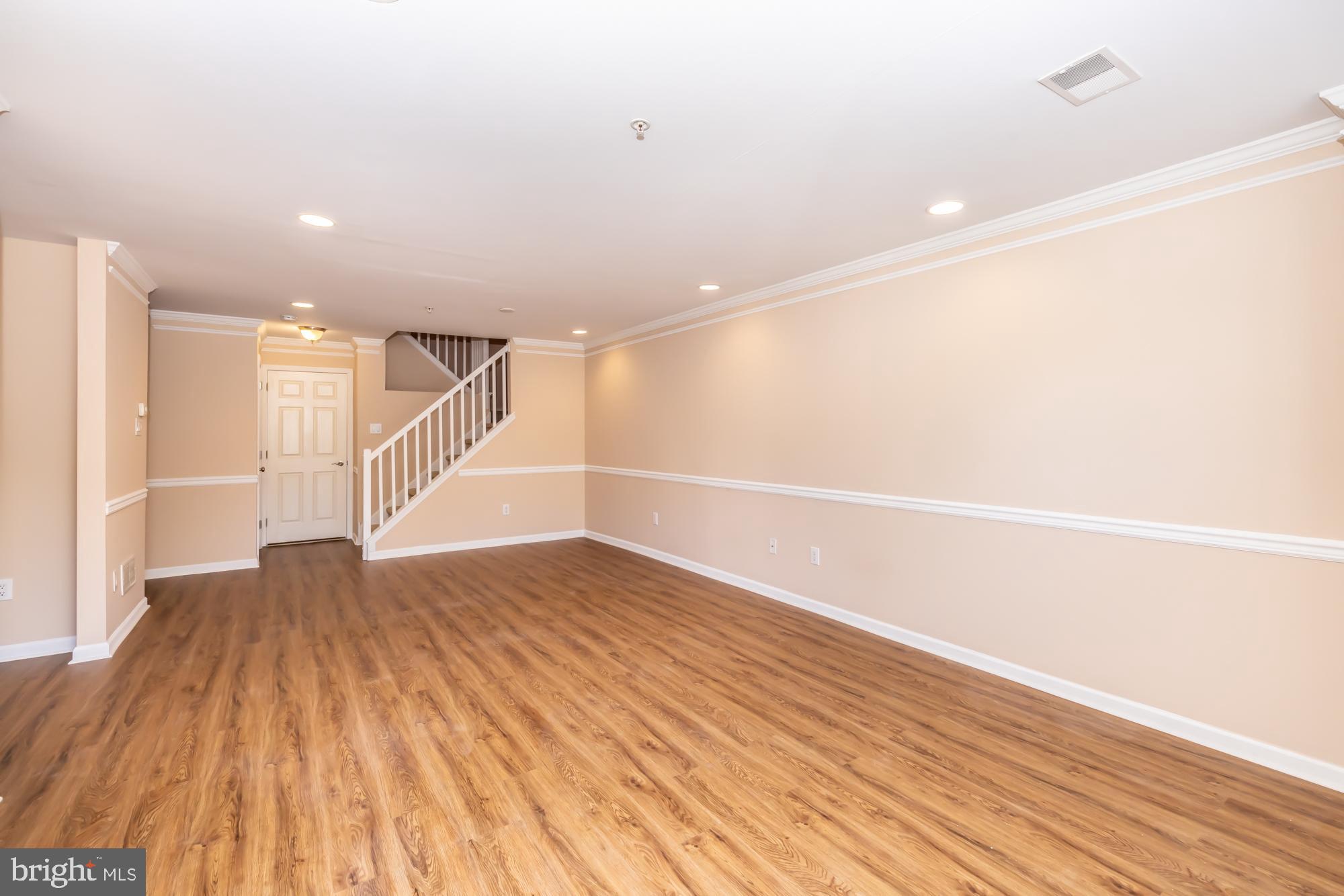 253 Flagstone Road, Unit 7 Chester Springs, PA 19425 - Photo 11 of 32 a view of an empty room with wooden floor