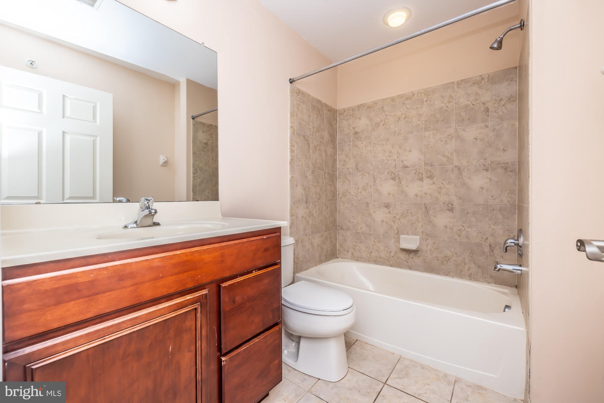 253 Flagstone Road, Unit 7 Chester Springs, PA 19425 - Photo 21 of 32 a bathroom with a sink a toilet and shower