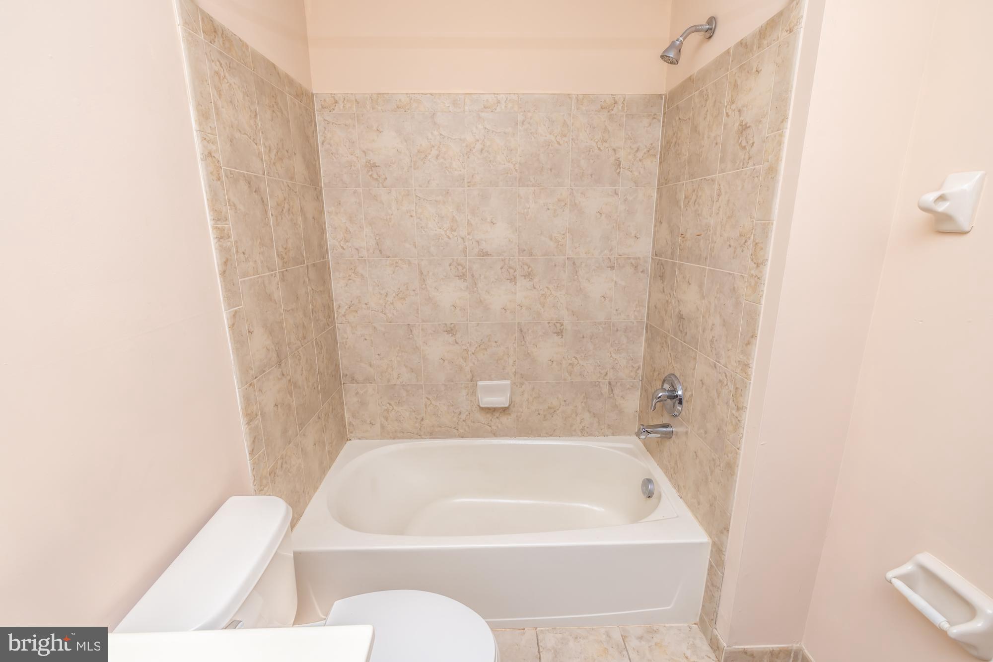 253 Flagstone Road, Unit 7 Chester Springs, PA 19425 - Photo 22 of 32 a bathroom with a bathtub and shower