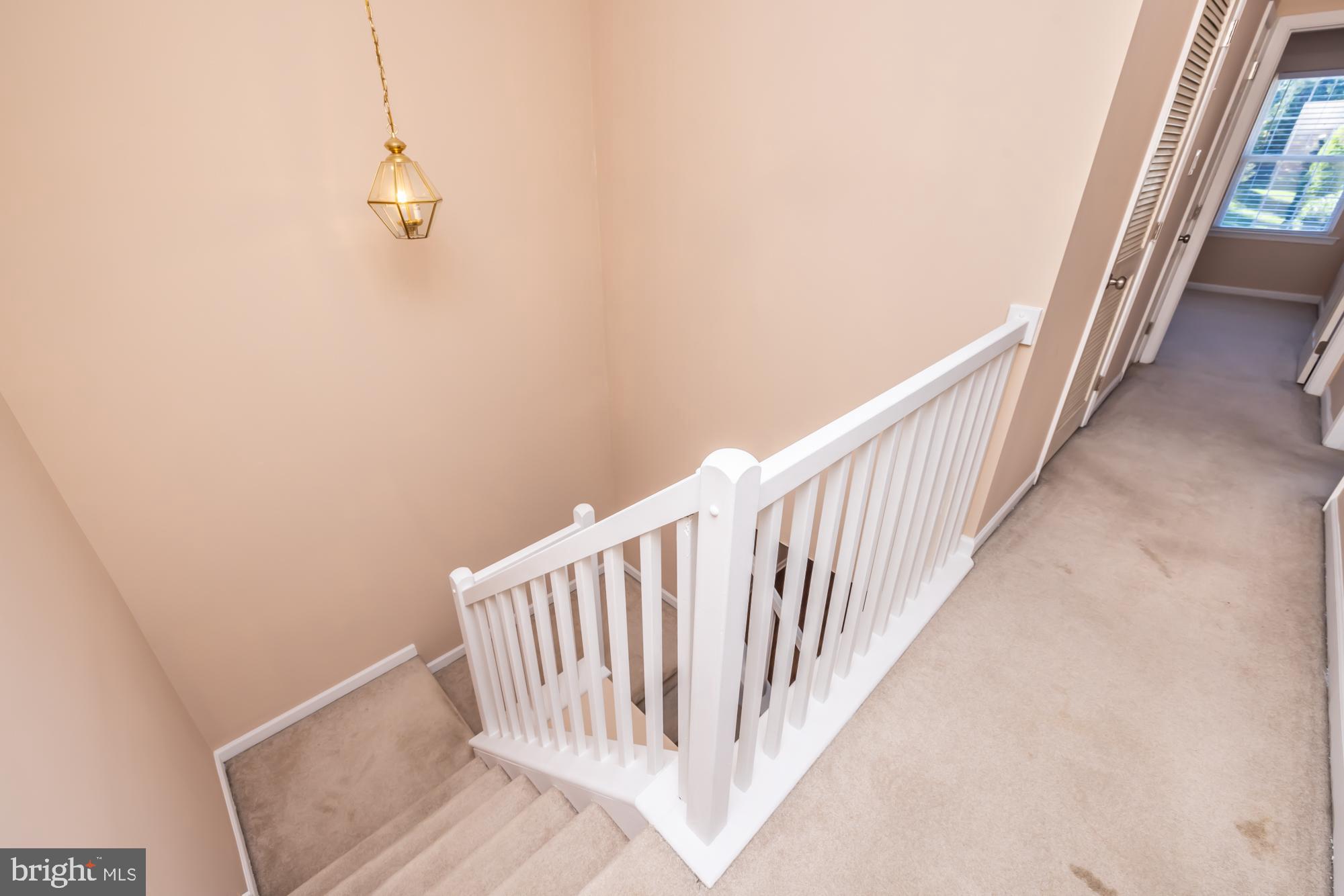 253 Flagstone Road, Unit 7 Chester Springs, PA 19425 - Photo 23 of 32 a view of a hallway with stairs