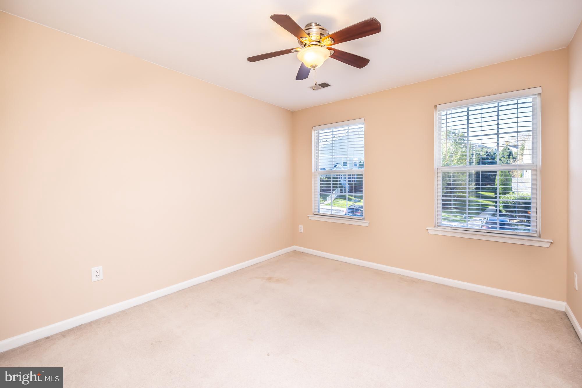 253 Flagstone Road, Unit 7 Chester Springs, PA 19425 - Photo 26 of 32 an empty room with windows and fan