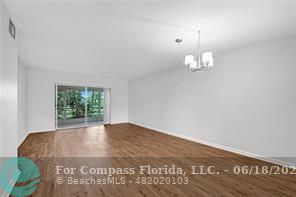 7605 Northwest 5th Place, Unit 101 Margate, FL 33063 - Photo 11 of 14 a view of an empty room with a window