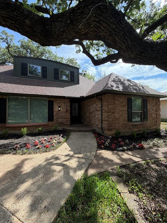 3609 Country Club Road Arlington, TX 76013 - Photo 3 of 40 a front view of a house with a yard