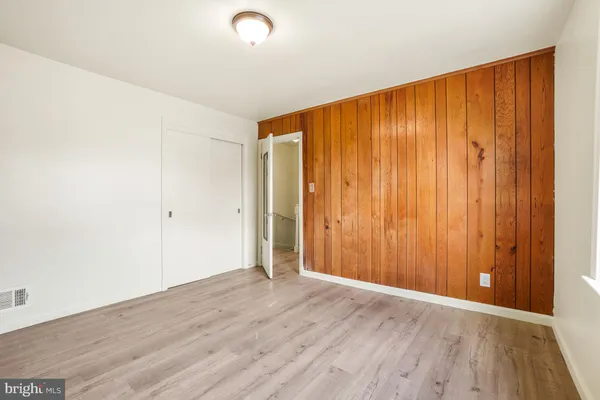 an empty room with wooden floor