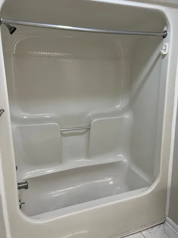 a close view of a bathtub in a bathroom