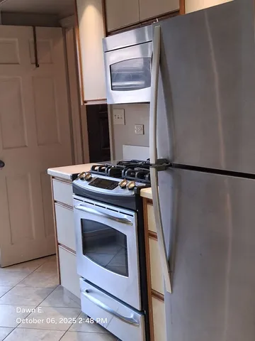 a close view of a stove and a microwave