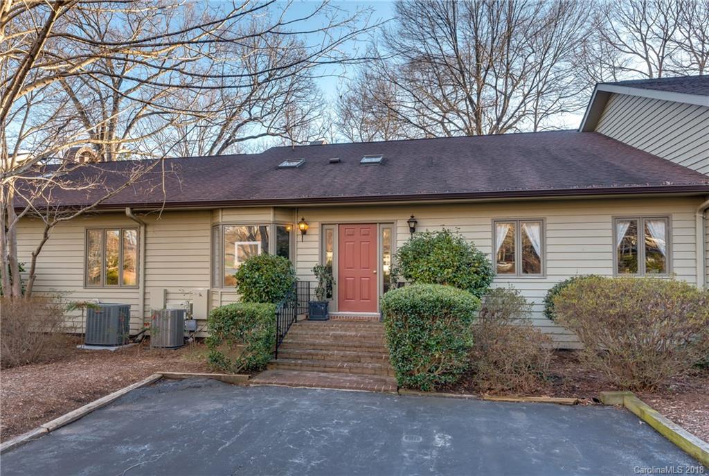 29 Hunting Country Trail Tryon, NC 28782 - Photo 1 of 20 a front view of a house with garden