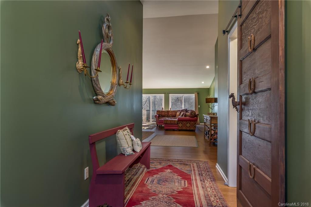 29 Hunting Country Trail Tryon, NC 28782 - Photo 2 of 20 a bed room with furniture and a rug