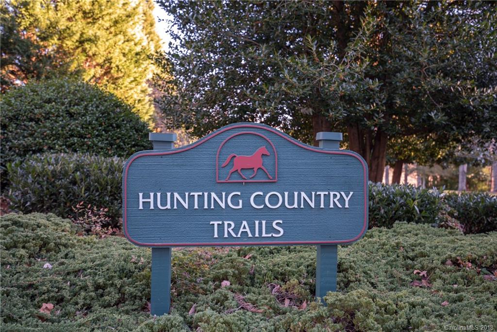 29 Hunting Country Trail Tryon, NC 28782 - Photo 20 of 20 a sign that is sitting on a wooden bench