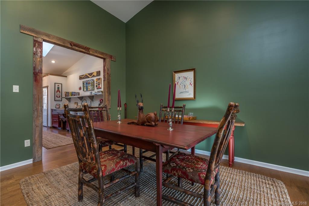 29 Hunting Country Trail Tryon, NC 28782 - Photo 5 of 20 a view of a dining room with furniture and wooden floor