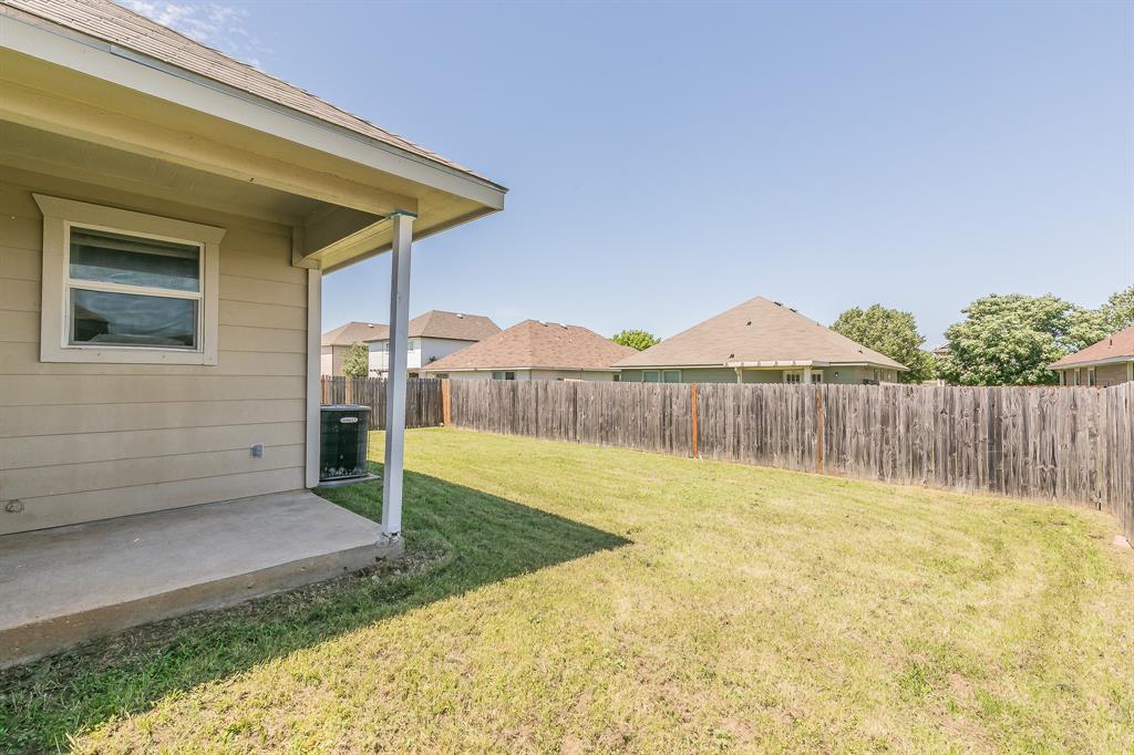 213 Cres Ridge Drive Fort Worth, TX 76140 - Photo 28 of 32 a view of a backyard with wooden fence
