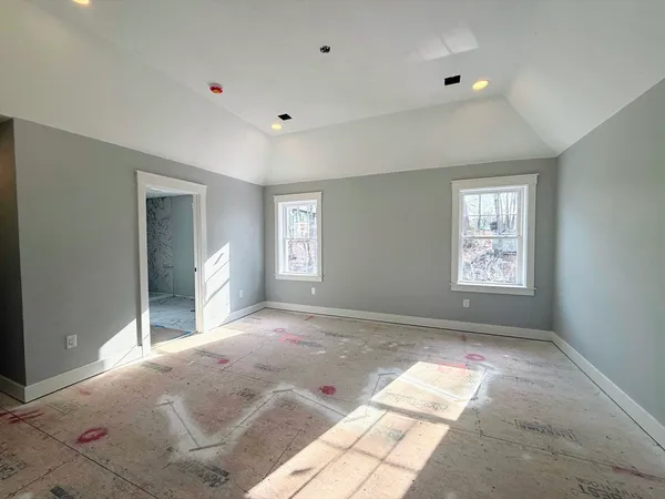a view of a big room with windows and closet