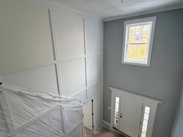 a room with a window and ceiling fan