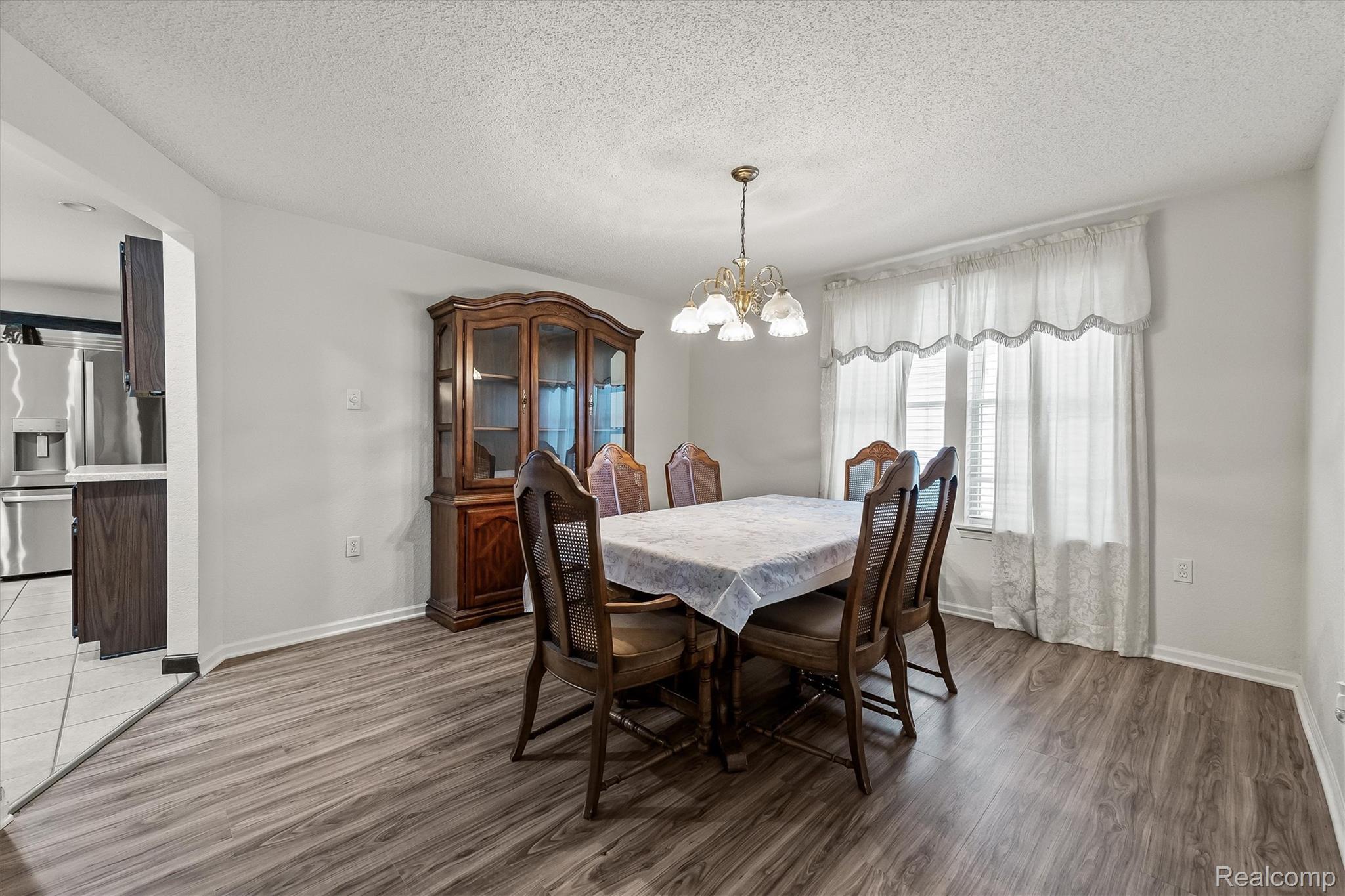 3553 North State Road Owosso, MI 48867 - Photo 9 of 45 Wood-finish flooring with a neutral wall color throughout