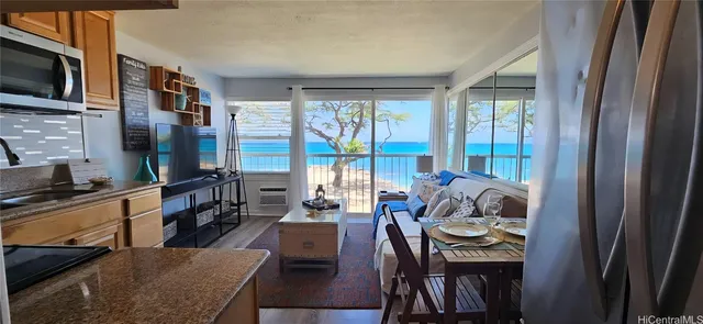 a living room with furniture fireplace and flat screen tv