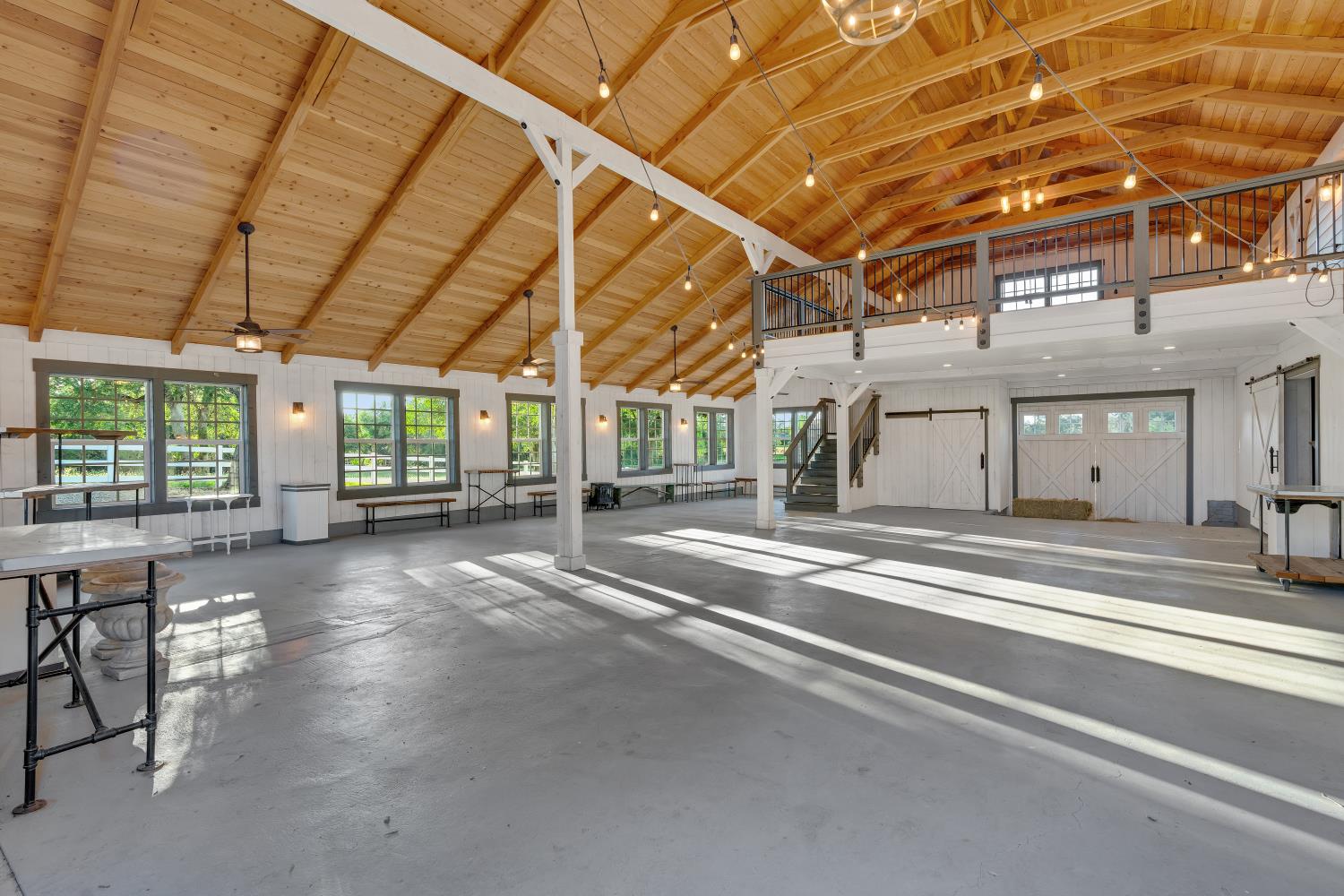 2905 Virginiatown Road Lincoln, CA 95648 - Photo 59 of 86 Spacious interior featuring a vaulted wood-finish ceiling, exposed beams, and a concrete floor