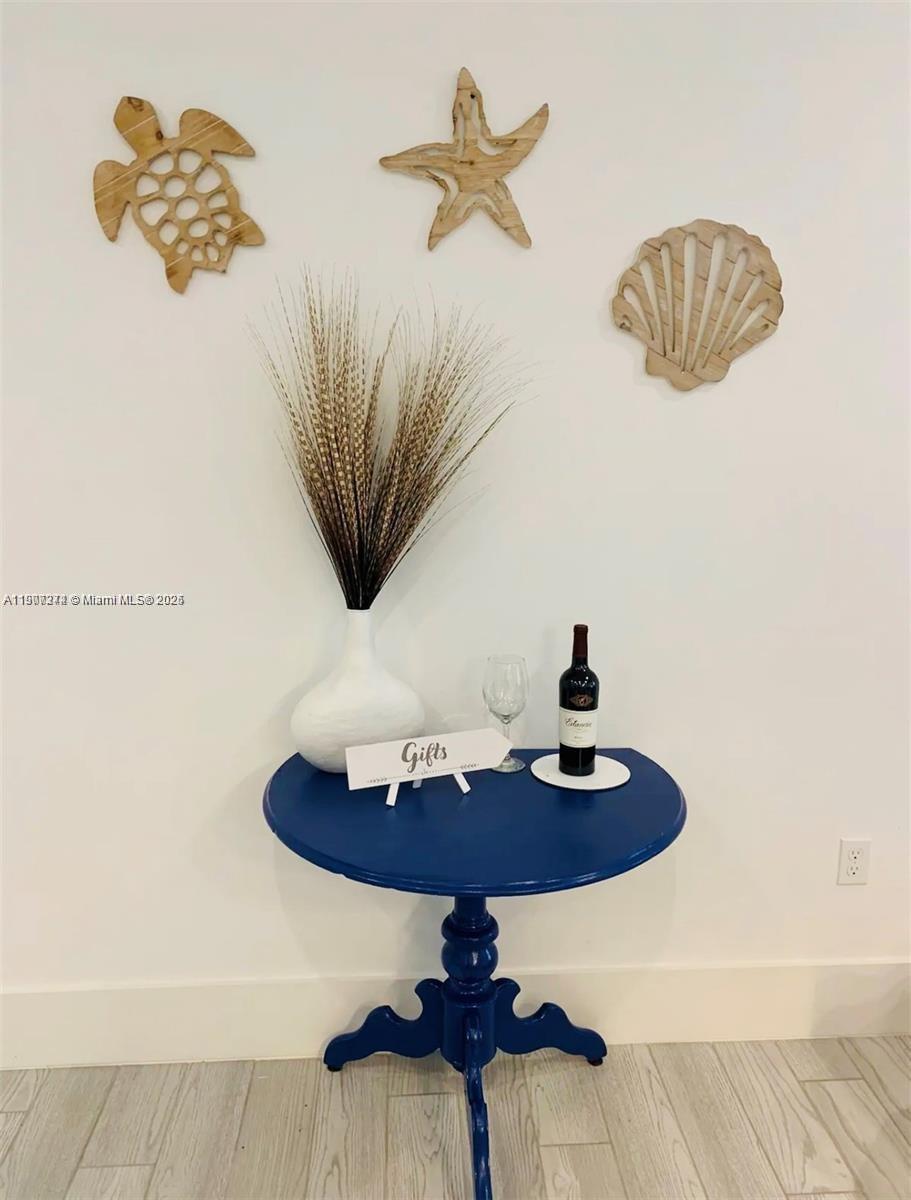 667 Southwest Cleveland Avenue, Unit 3 Stuart, FL 34994 - Photo 16 of 42 a vase of flowers sitting on a table