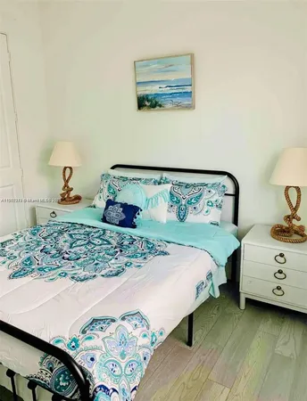 a bedroom with a bed and a dresser