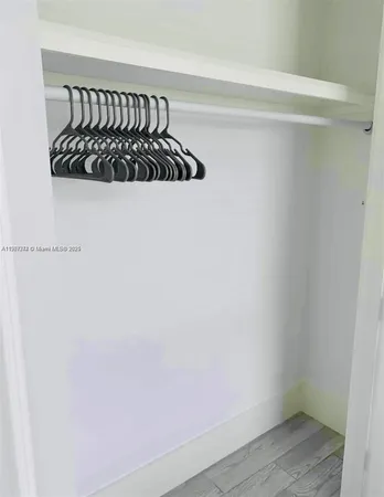 a white wall with a window