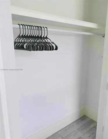 a white wall with a window