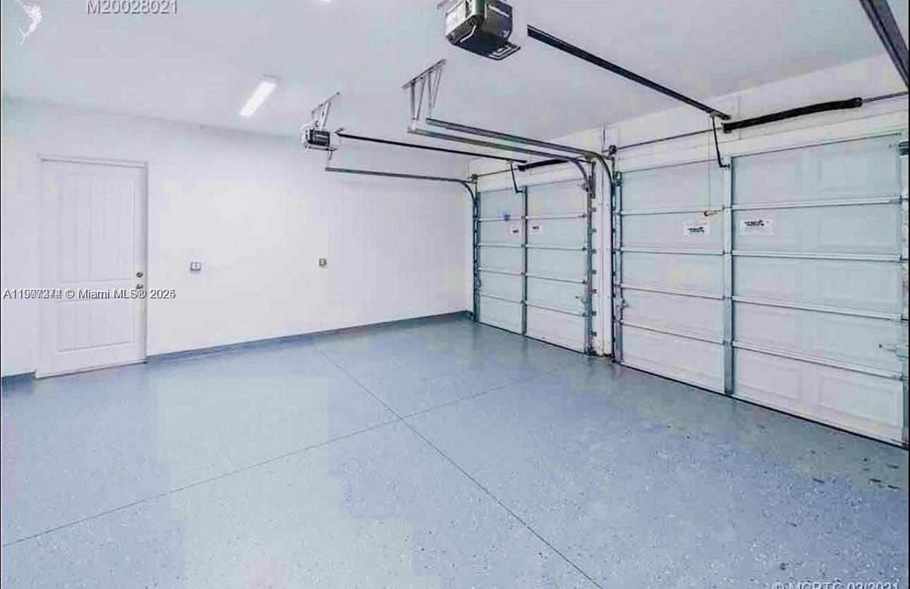 667 Southwest Cleveland Avenue, Unit 3 Stuart, FL 34994 - Photo 36 of 42 a view of a garage