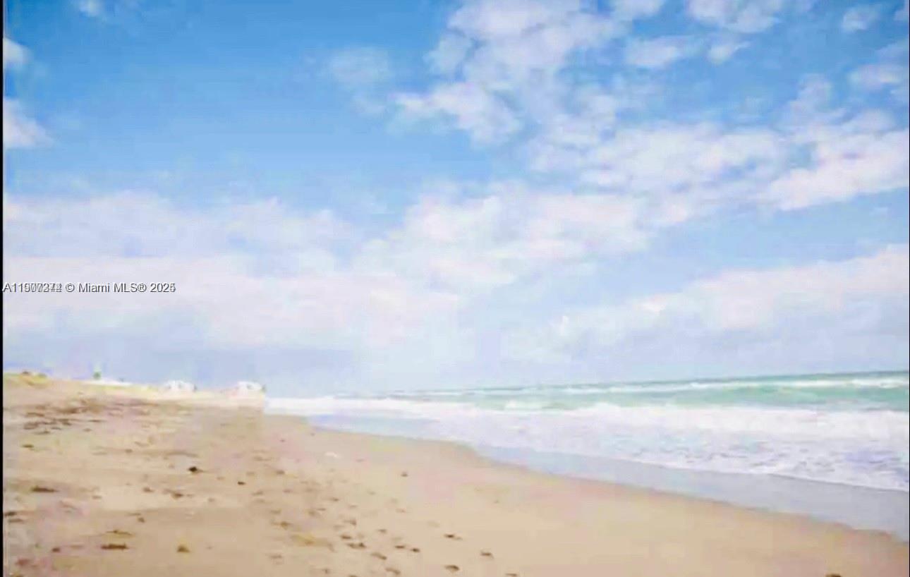 667 Southwest Cleveland Avenue, Unit 3 Stuart, FL 34994 - Photo 37 of 42 a view of beach and ocean