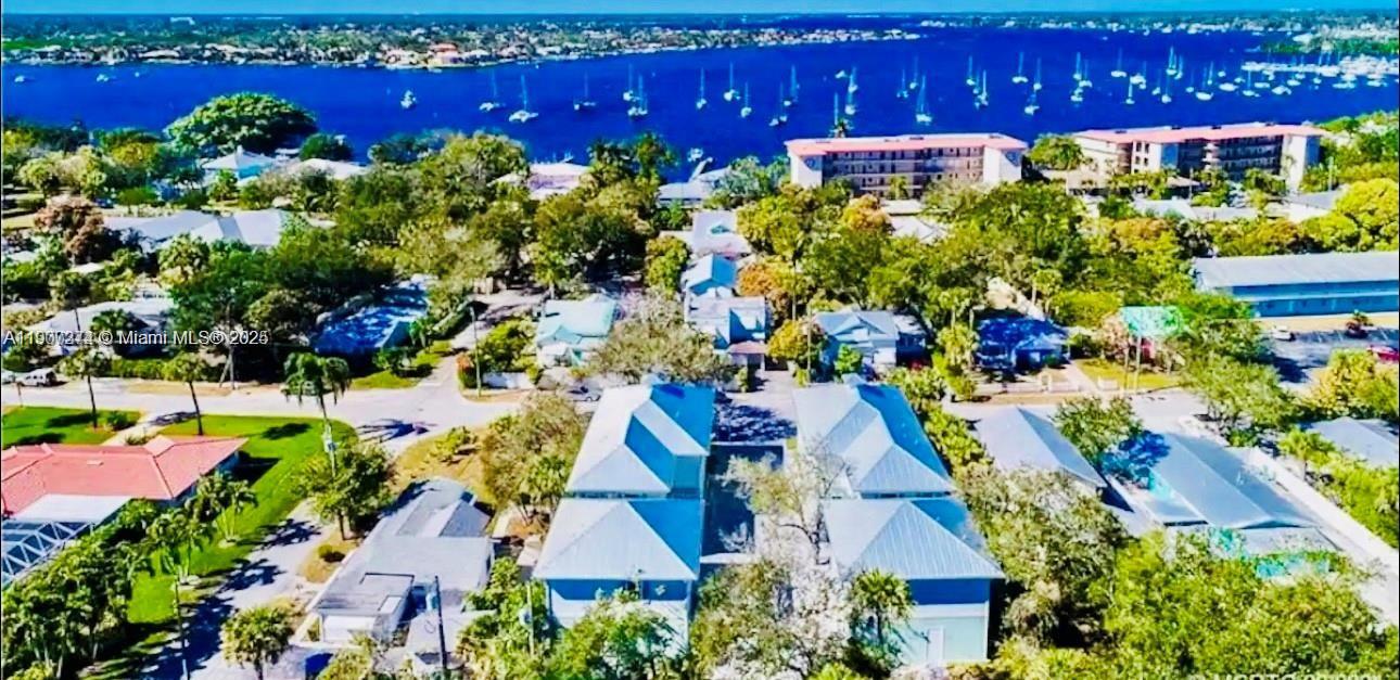 667 Southwest Cleveland Avenue, Unit 3 Stuart, FL 34994 - Photo 42 of 42 an aerial view of a house with yard swimming pool and outdoor seating