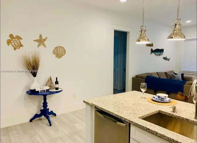 a very nice looking dining room with a table and chairs