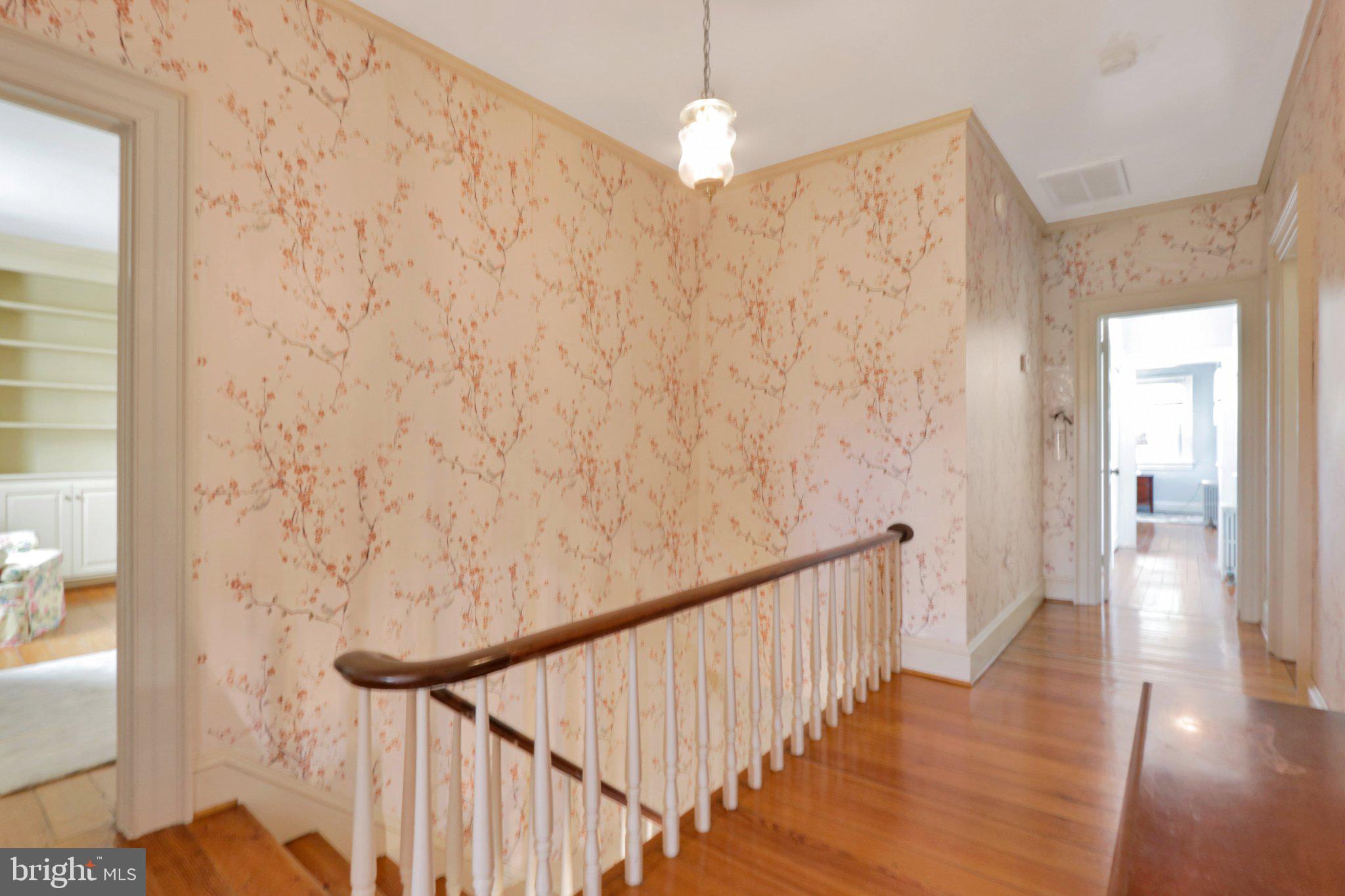 2598 Cherrystone Road Cape Charles, VA 23310 - Photo 25 of 47 Charming hallway with floral wallpaper.