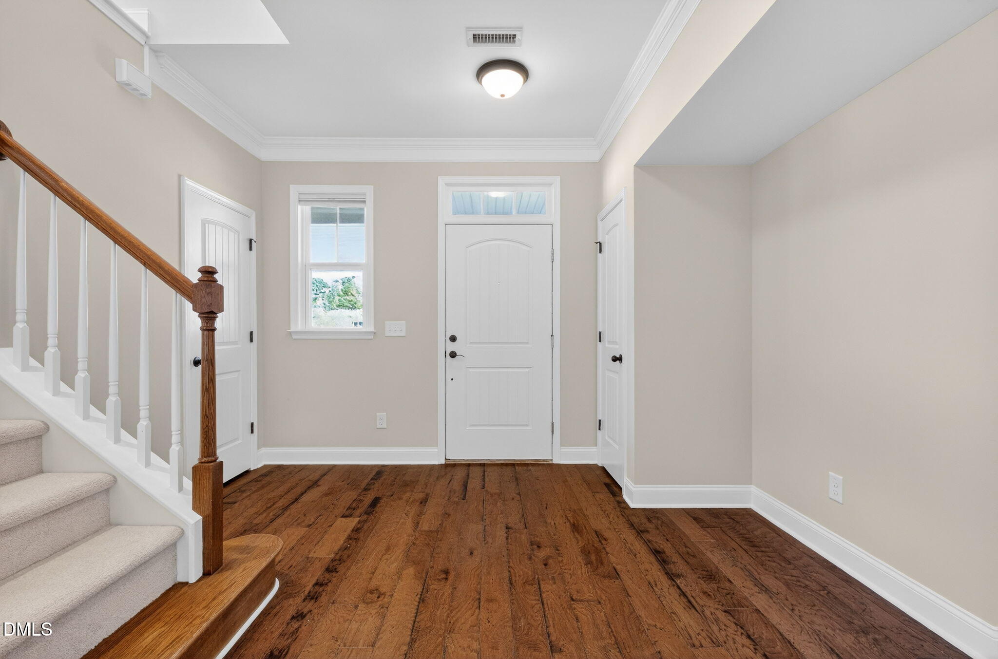 1304 Barnford Mill Road Wake Forest, NC 27587 - Photo 7 of 44 a view of a room with wooden floor and staircase