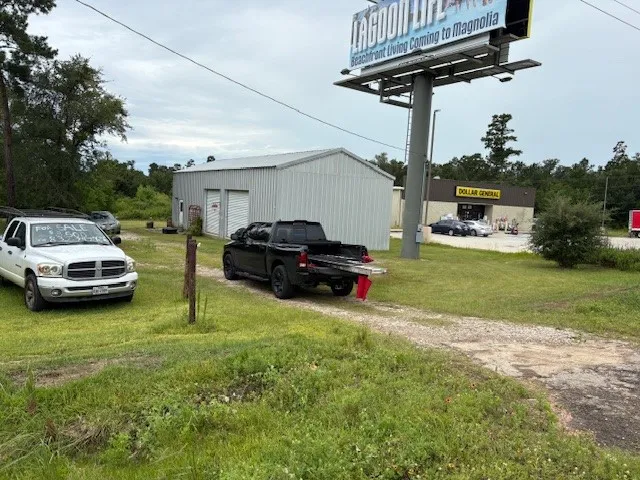 a view of garden with cars