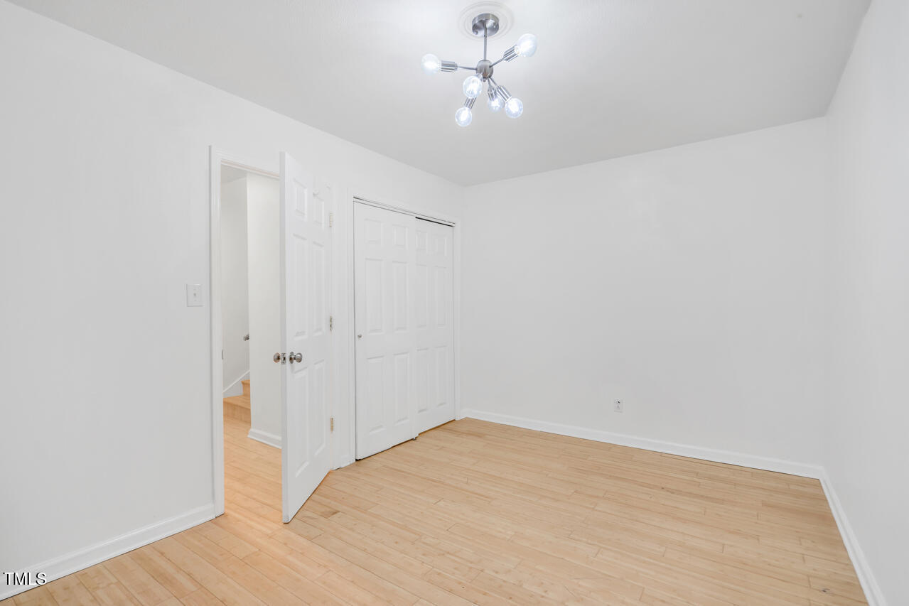 121 Lady Bug Lane Chapel Hill, NC 27516 - Photo 14 of 36 a view of a room with a ceiling fan