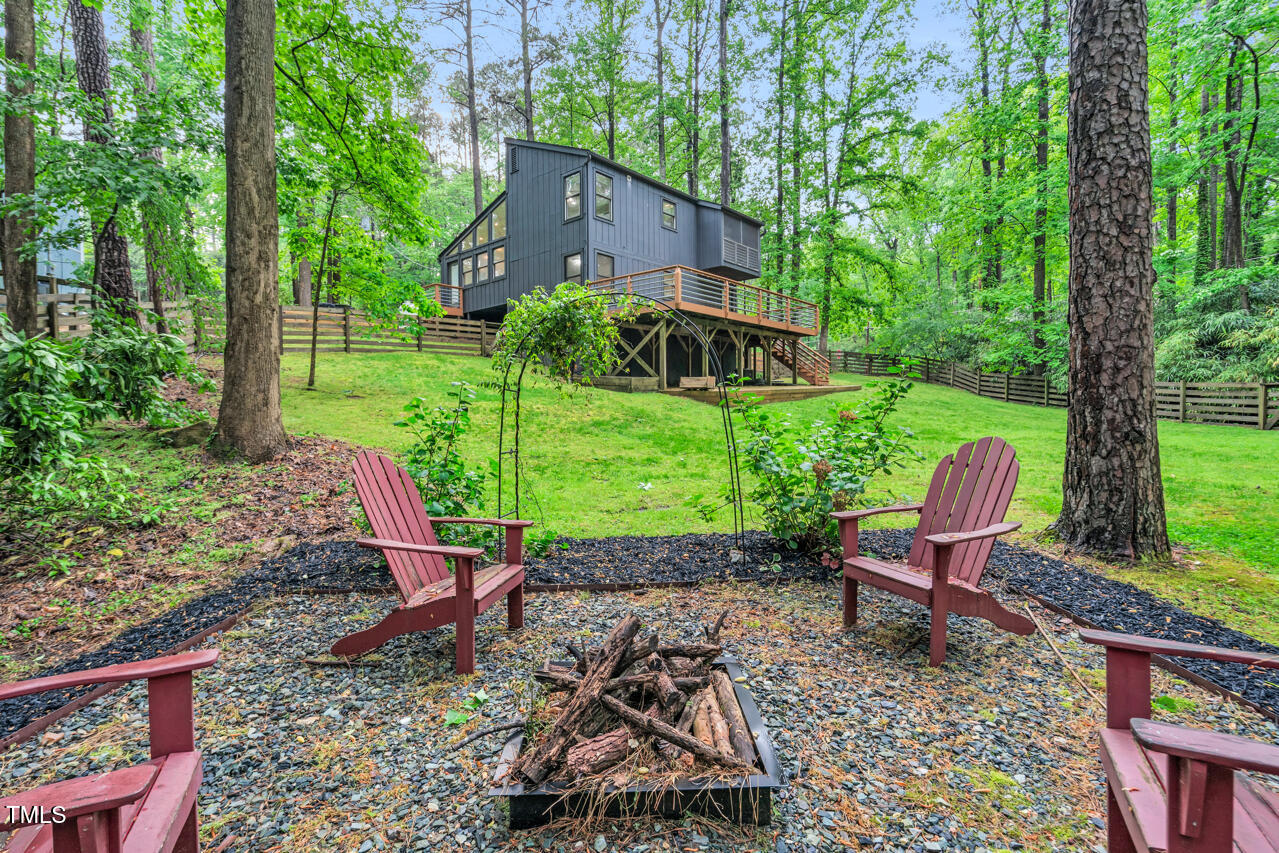 121 Lady Bug Lane Chapel Hill, NC 27516 - Photo 31 of 36 a view of a table and chairs in backyard of the house