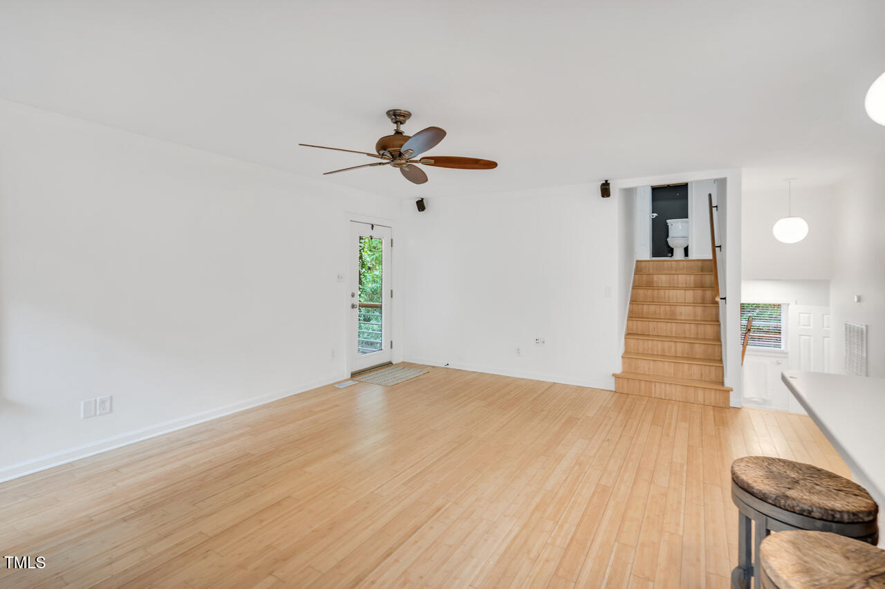 121 Lady Bug Lane Chapel Hill, NC 27516 - Photo 5 of 36 a view of a room with wooden floor and ceiling fan