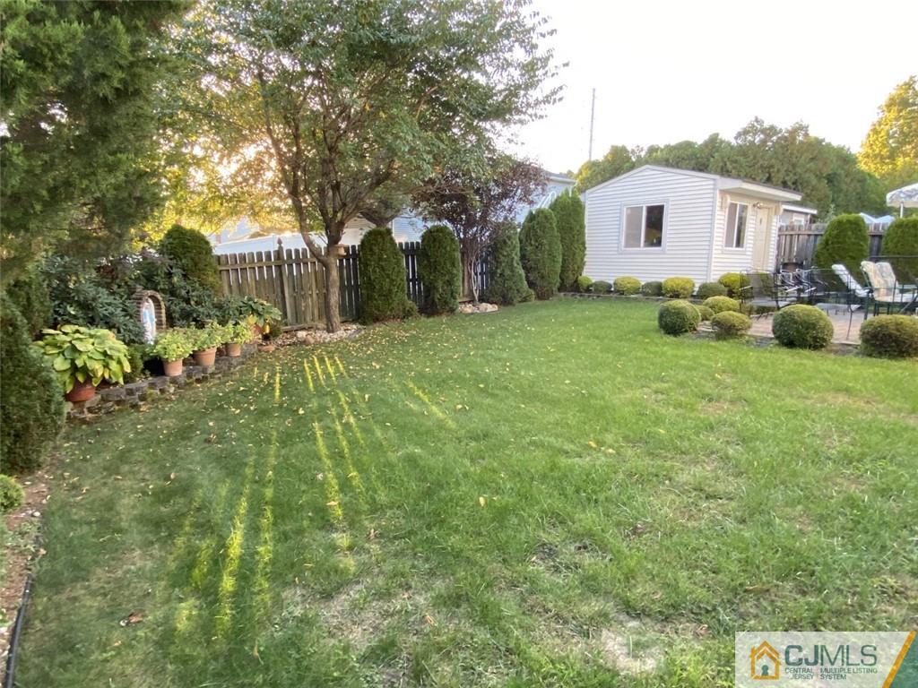 58 Brookside Road Edison, NJ 08817 - Photo 27 of 34 a view of a house with a backyard