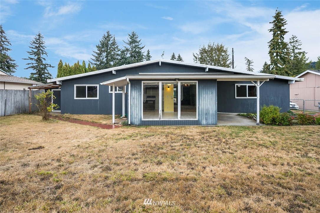 4625 Northeast 23rd Street Renton, WA 98059 - Photo 23 of 24 a house with trees in the background