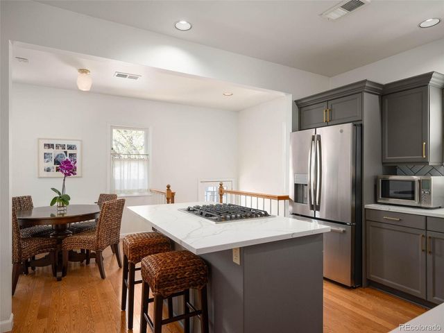 a kitchen with a table and chairs